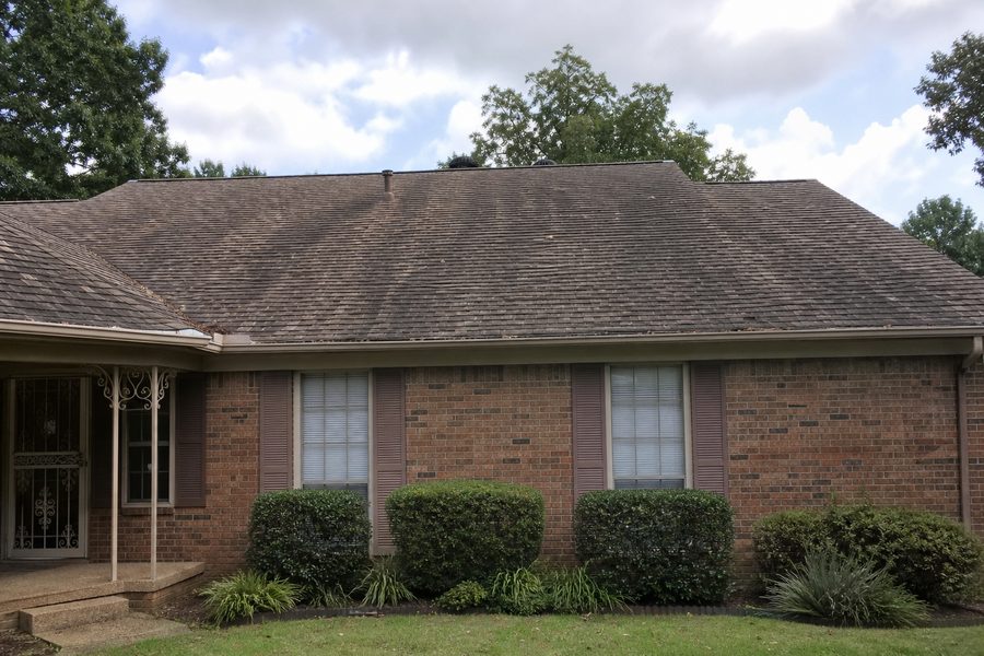 Before roof replacement showing aging asphalt shingles discoloration curling and old gutters for Cerpa Construction LLC renovation.